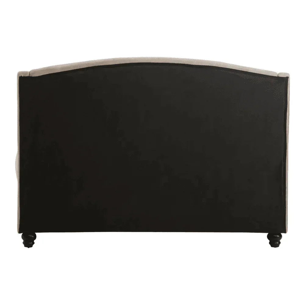 Upholstered sofa back with black panel and curved top on turned wooden legs