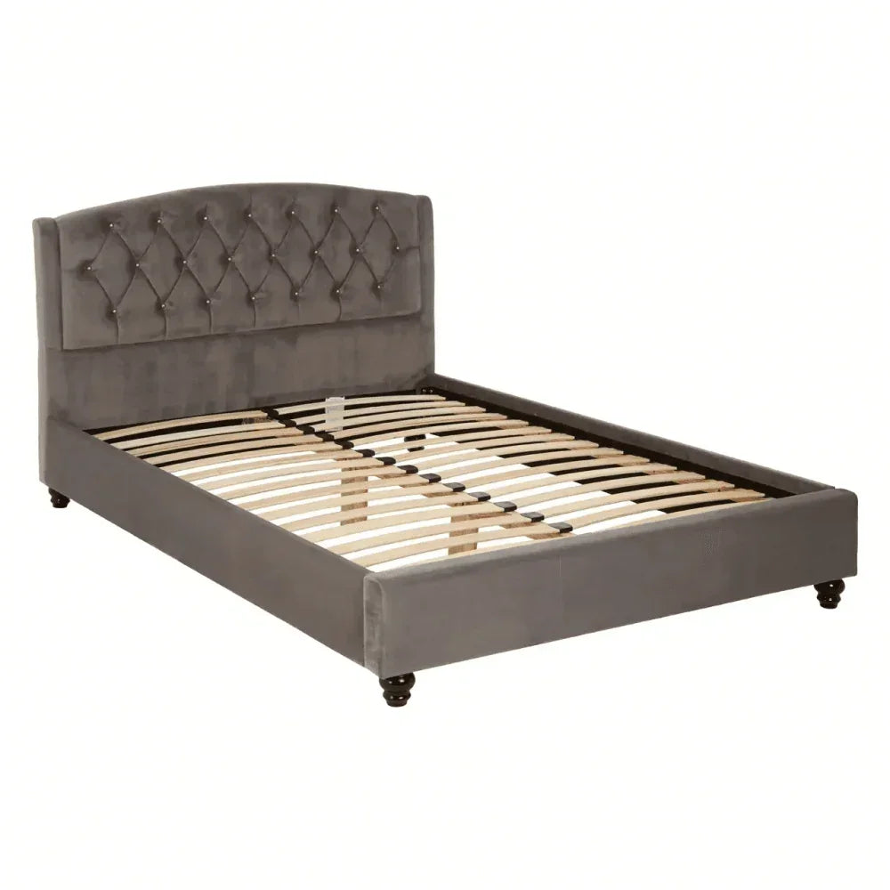 Grey velvet bed frame with tufted headboard and wooden slats, front angled view