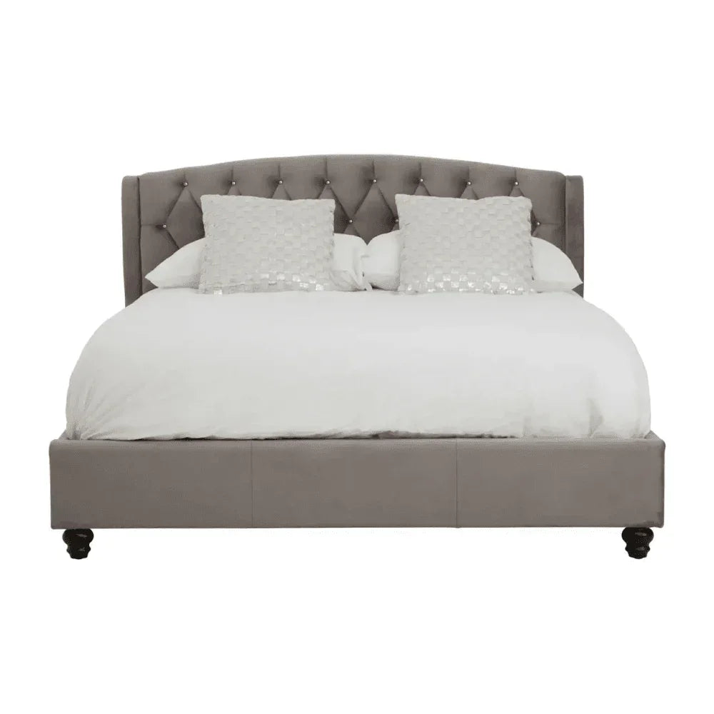 Grey upholstered bed frame with tufted headboard and white bedding, front view