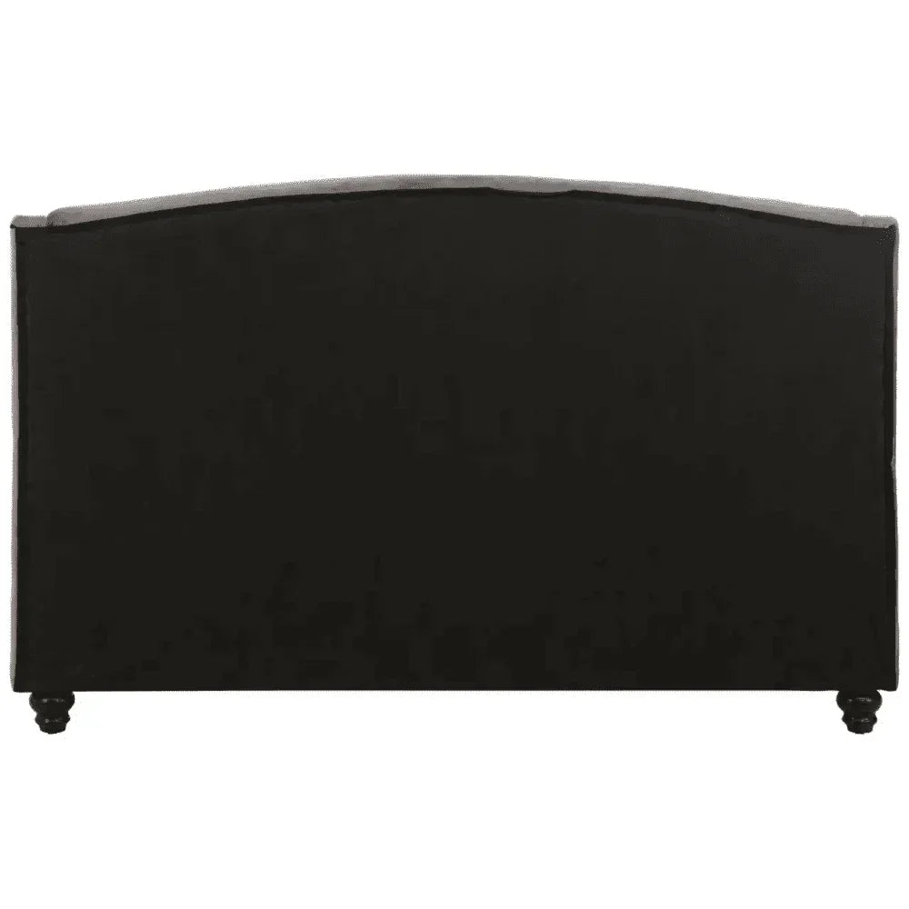 Black upholstered bed headboard rear view with curved top and wooden legs