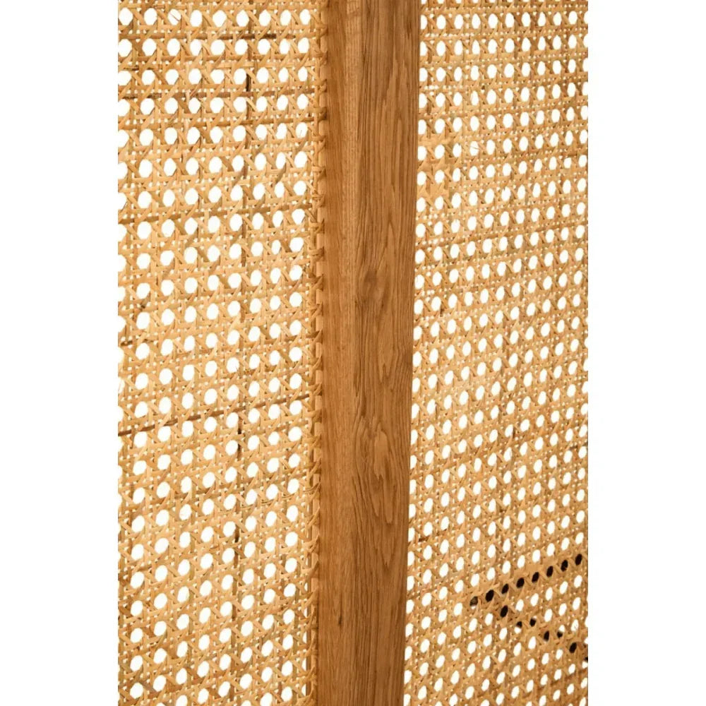 Closeup of rattan furniture panel with natural wood frame and woven cane detailing