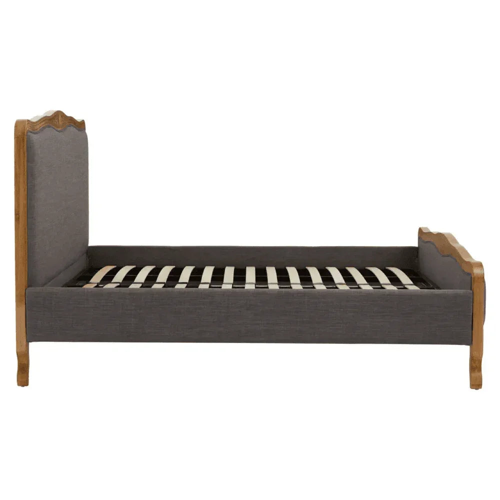 Upholstered wooden bed frame with grey fabric and slatted base, side profile view