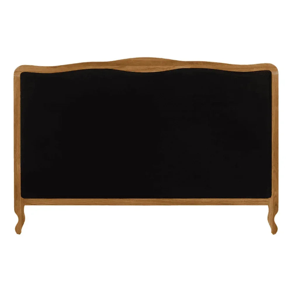 Black upholstered headboard with natural wood frame and curved top edge