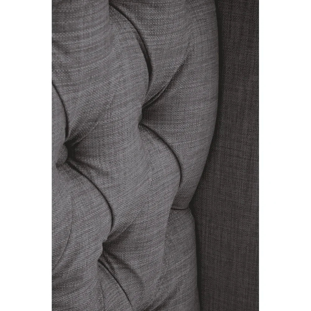 close-up of tufted grey fabric sofa upholstery with textured weave