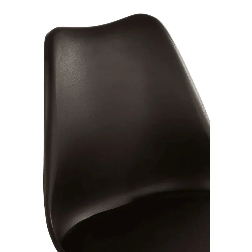 Close-up of black dining chair with curved plastic backrest