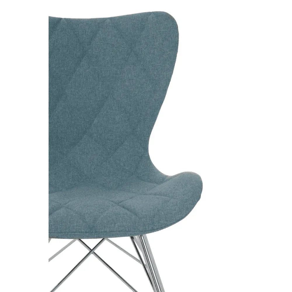 Blue fabric dining chair with quilted seat and chrome legs, partial side view
