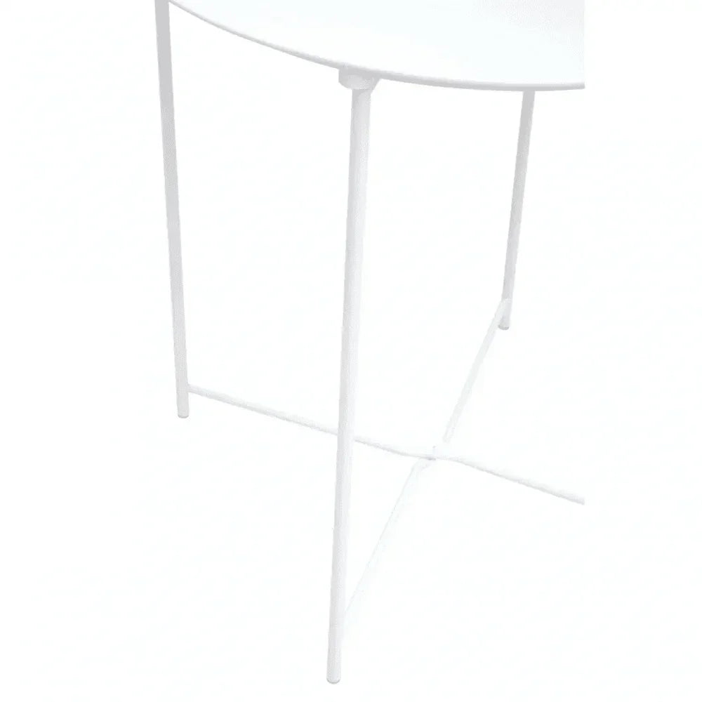 White metal table legs and round tabletop, minimalist modern furniture design