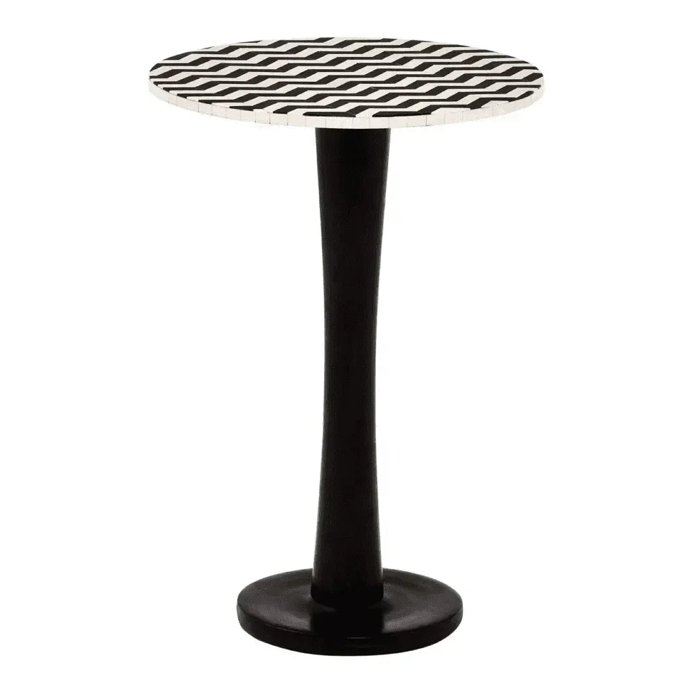 Round side table with black and white geometric top and slender black base