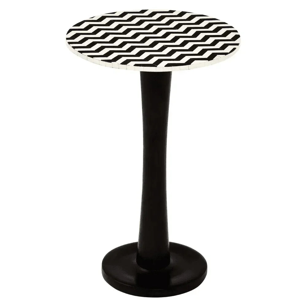 Round accent table with black and white chevron patterned top and black pedestal base
