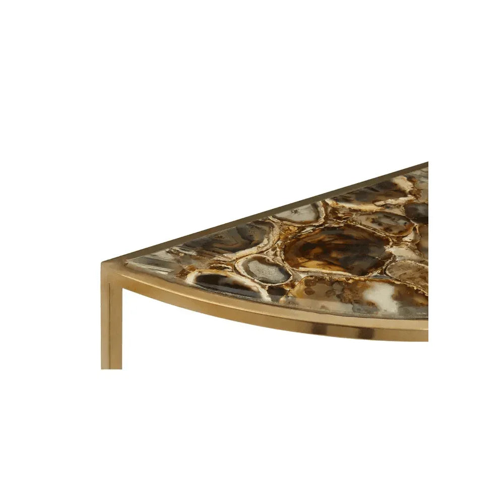 Close up of gold metal and brown stone coffee table corner with geometric detail