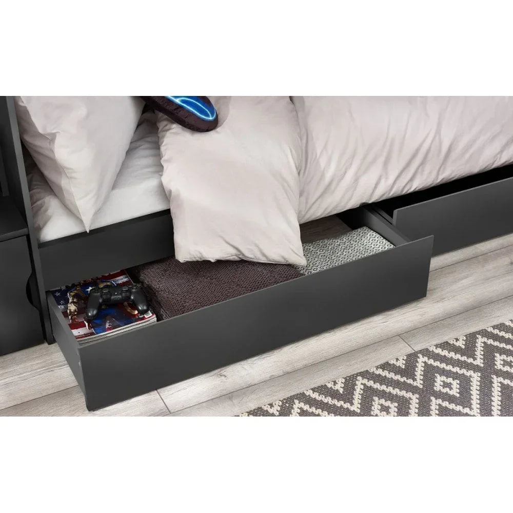 Black storage bed with open underbed drawer showing books, game controller and folded blanket