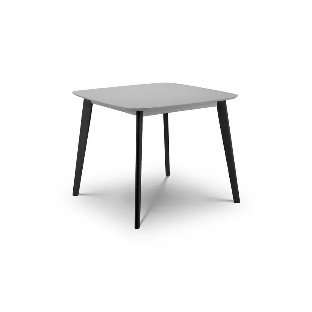 Modern square dining table with grey top and black angled legs on white background