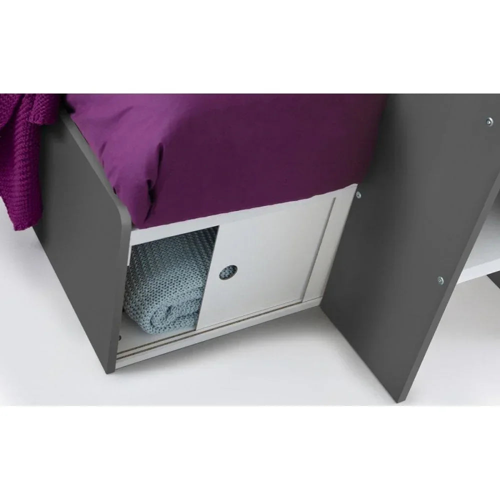 Grey storage bed with sliding door compartment and folded blanket underneath mattress