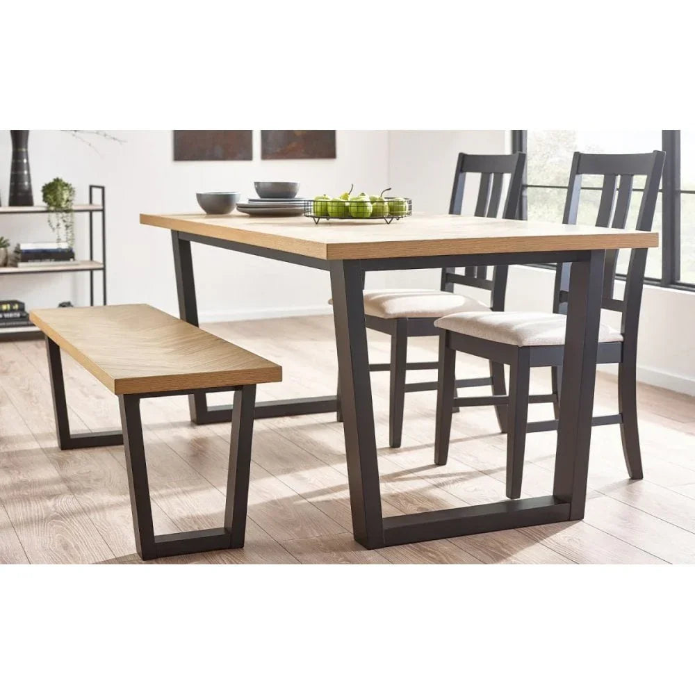 Modern dining table set with oak top, black metal legs, matching bench, and cushioned chairs