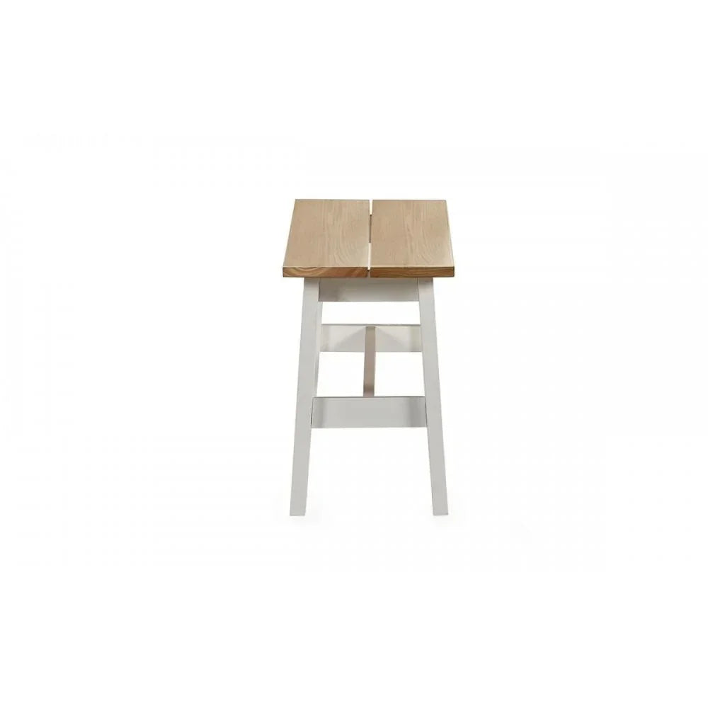 Wooden bar stool with natural seat and white legs, front view on white background
