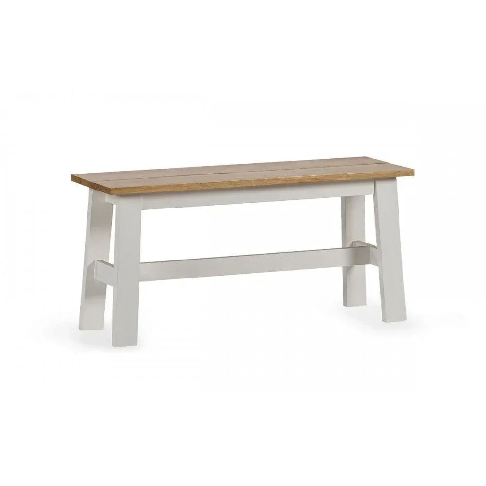 Wooden dining bench with light oak seat and white painted legs, angled side view
