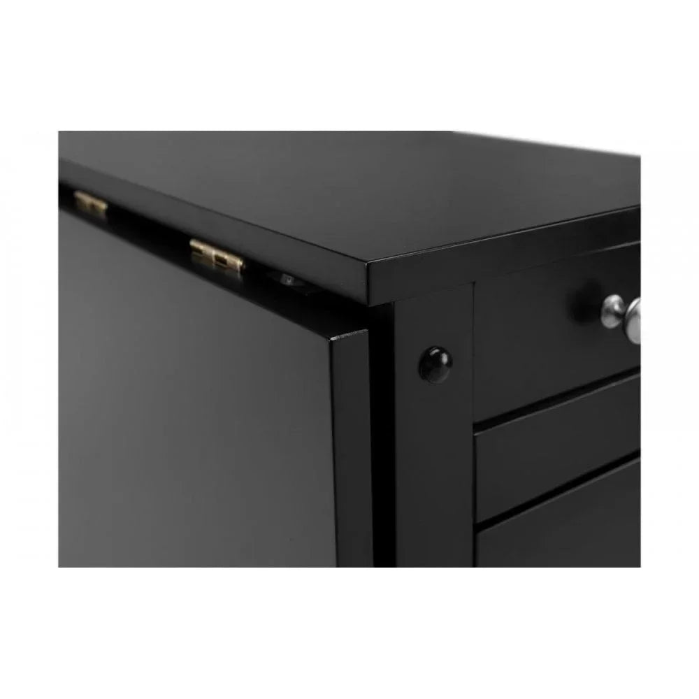 Close-up of black wooden cabinet with silver knobs and hinged side panel