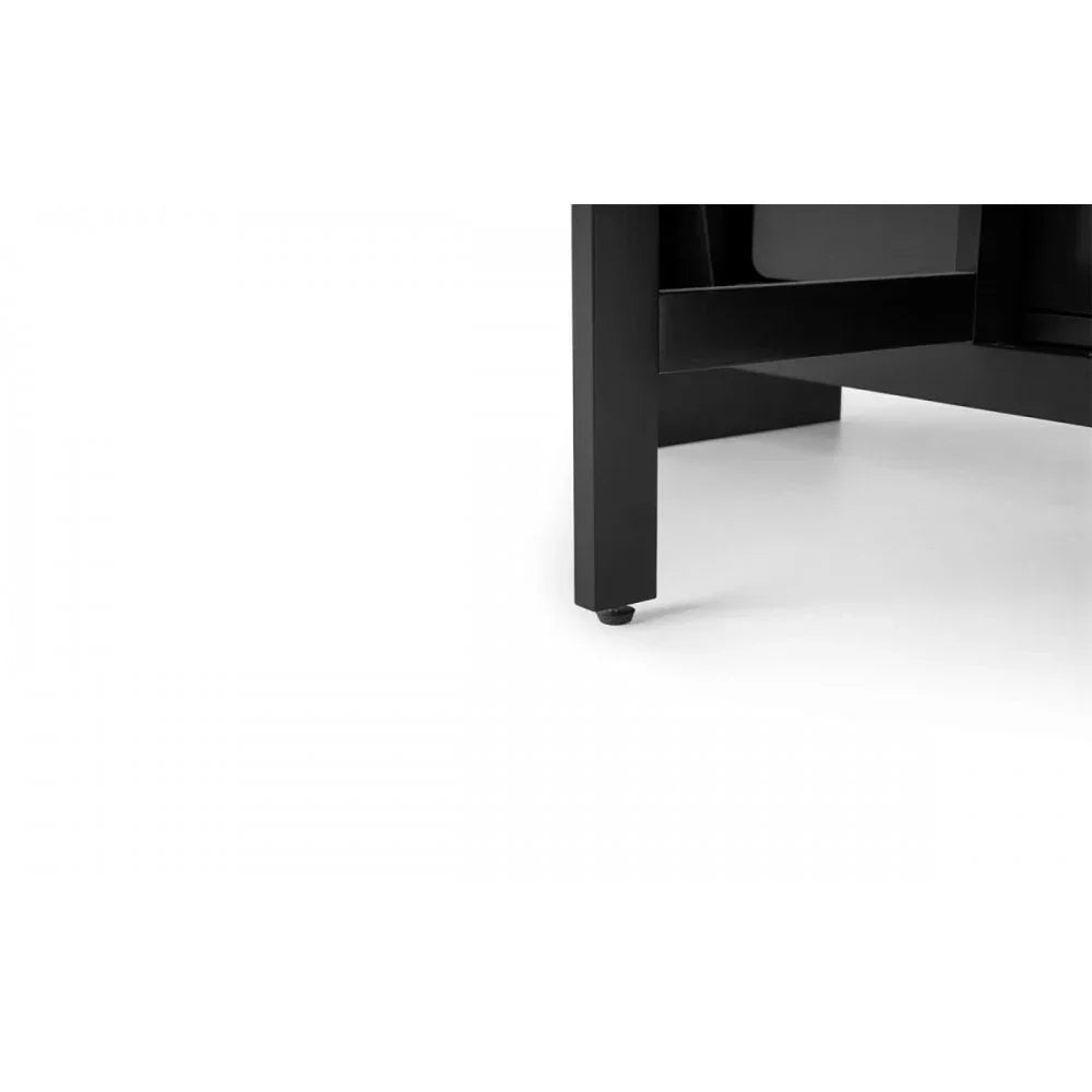 Black furniture leg with clean lines on white floor, close-up view of modern table base