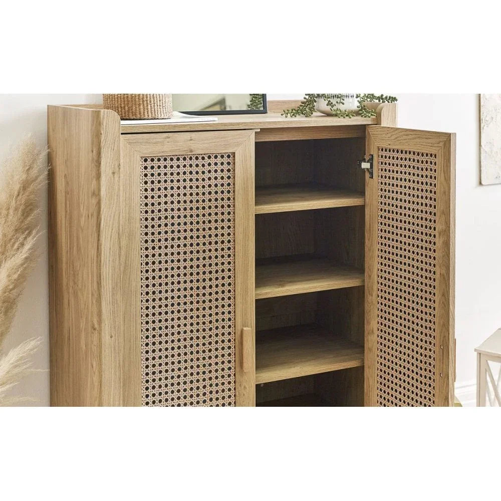 Oak storage cabinet with rattan doors and open shelves, styled in a modern living space