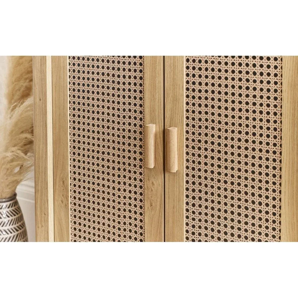 Natural wood cabinet doors with rattan paneling and vertical wooden handles