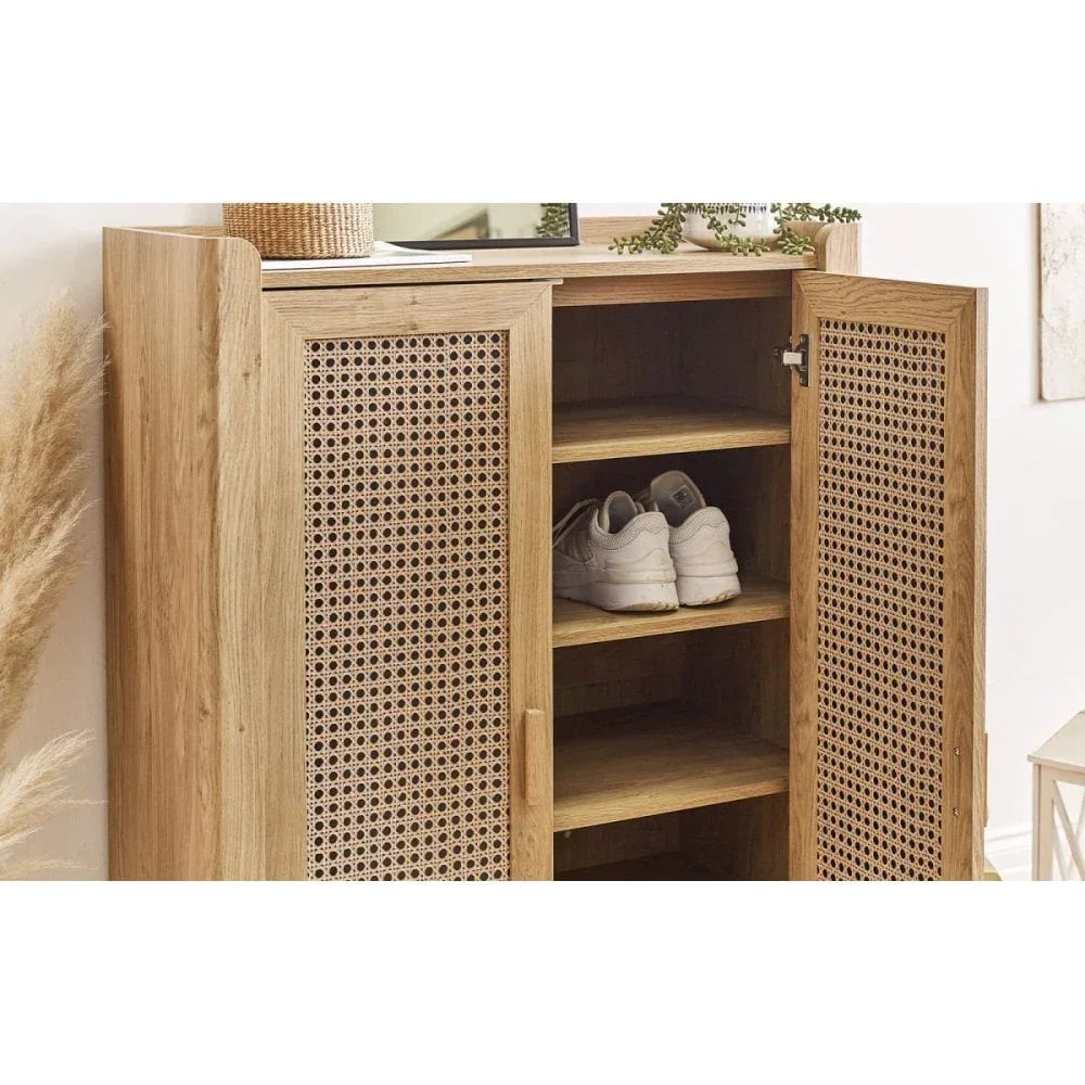 Oak shoe cabinet with rattan doors and shelves, one door open showing shoes inside