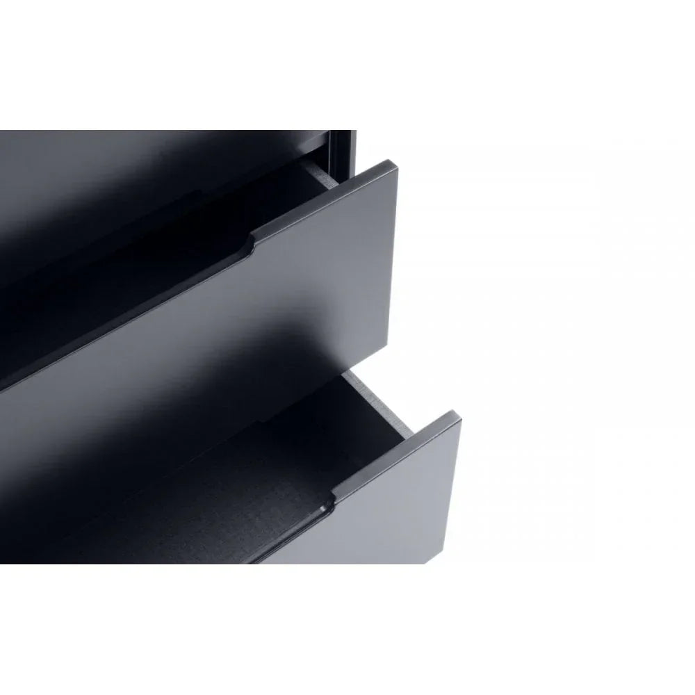 Black chest of drawers with two open drawers, close-up view of matte finish and handles