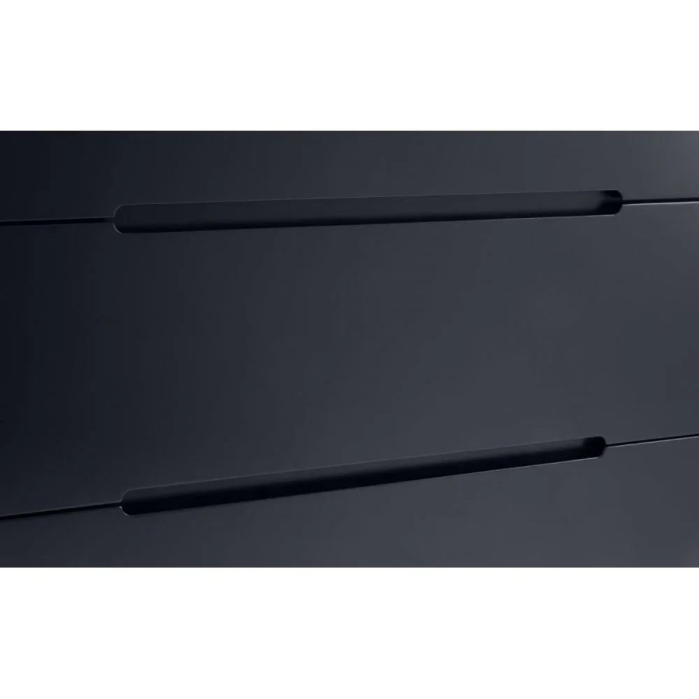 Close-up of black drawer front with integrated handle on modern furniture