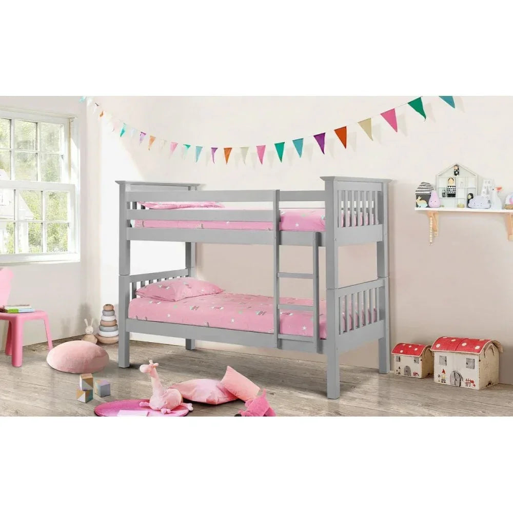Grey wooden bunk bed with ladder and pink bedding in a children's bedroom