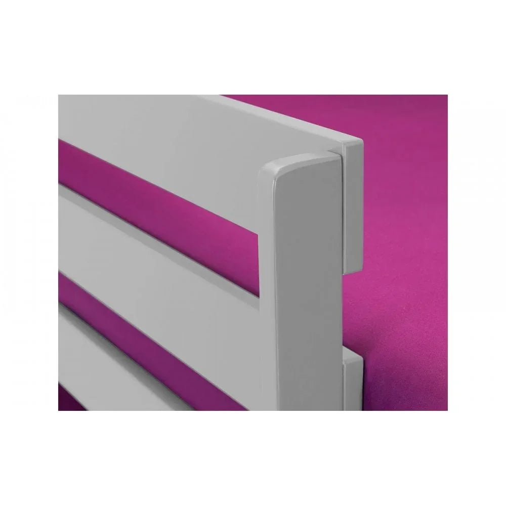 White wooden bed frame with magenta mattress detail, close-up of headboard design