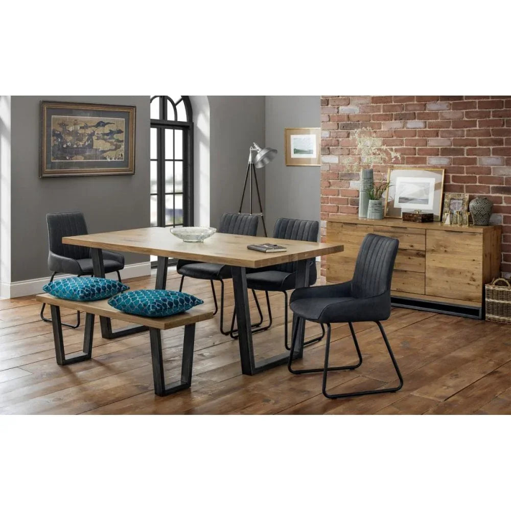 Oak dining table set with black metal legs, grey fabric chairs and bench in modern dining room