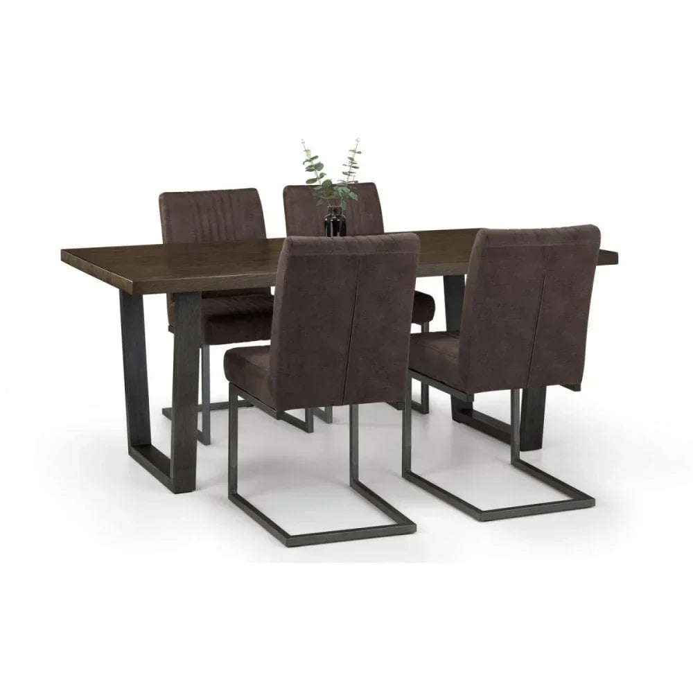 Dark wood dining table with four brown upholstered chairs and black metal legs