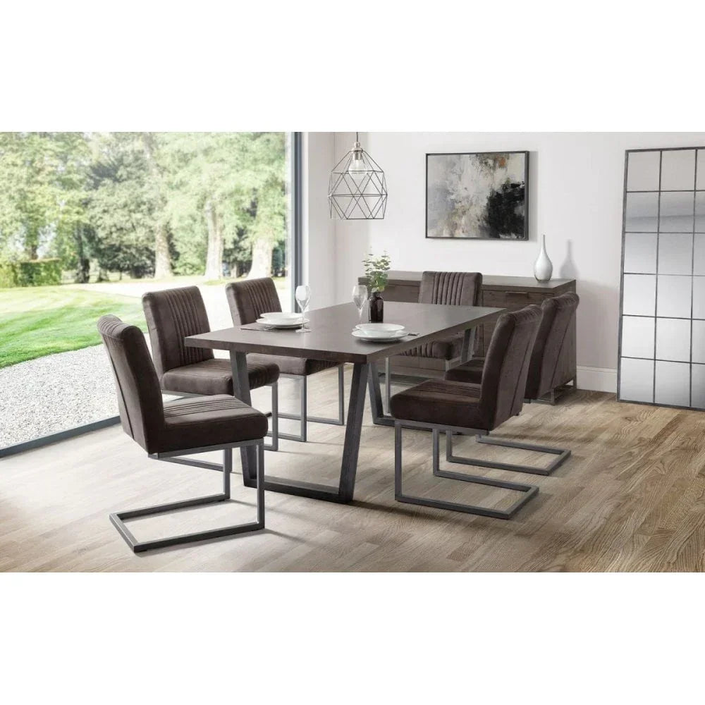 Modern dining table set with six brown velvet chairs in contemporary dining room