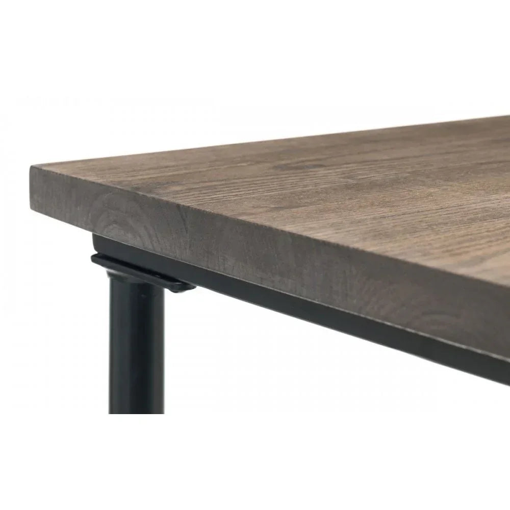 Closeup of wooden dining table top with black metal frame support