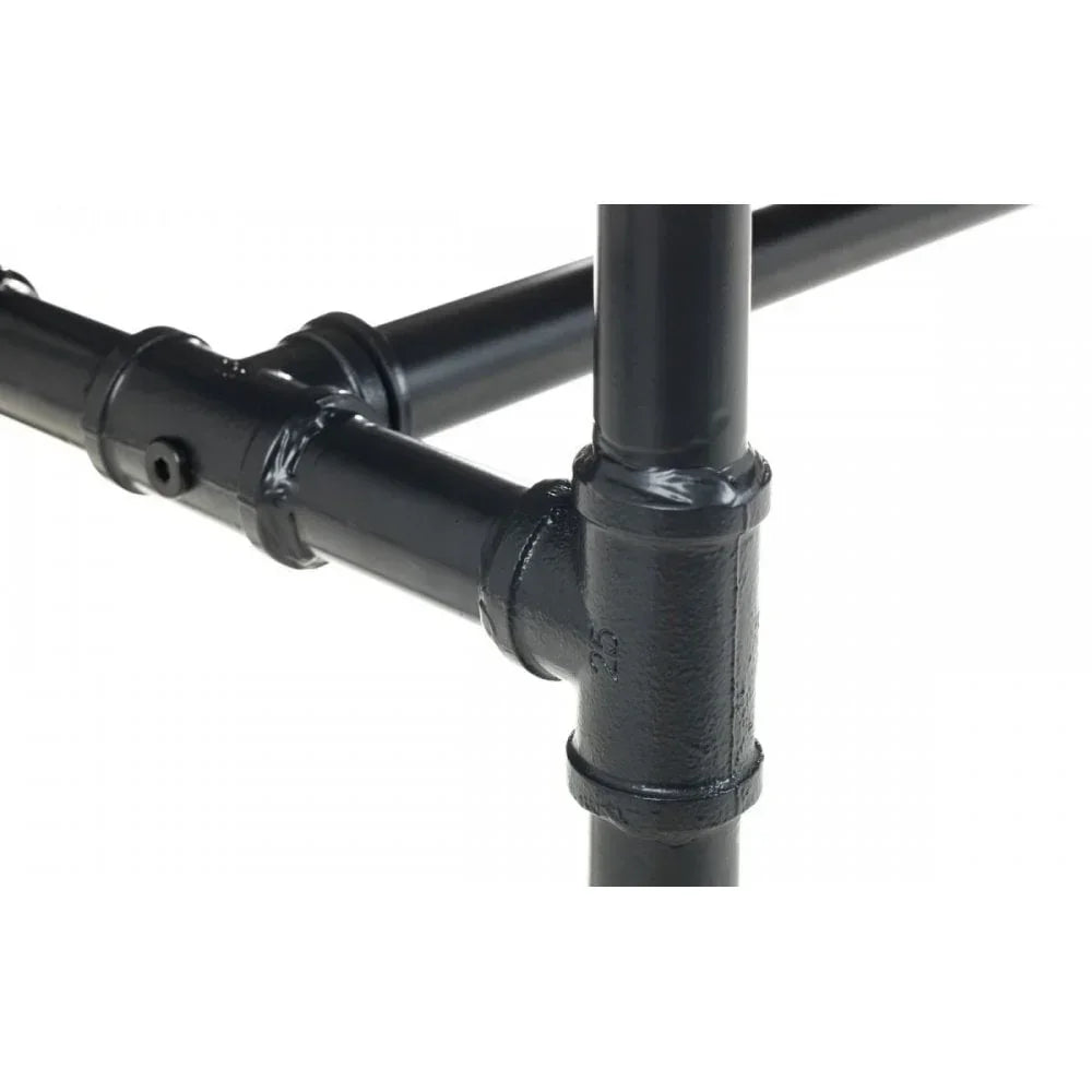 Black metal table frame with visible pipe joints and smooth finish, close-up angle