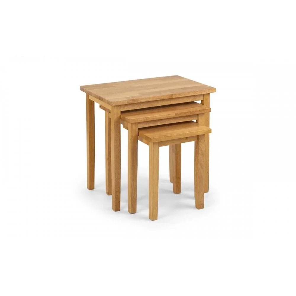 nest of three oak side tables with rectangular tops and straight legs on white background