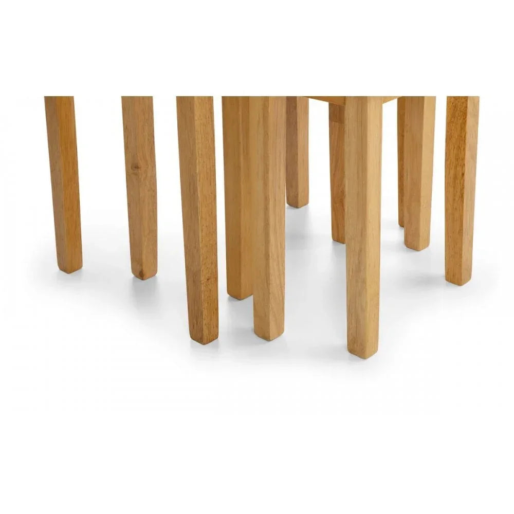 Closeup of oak dining table and chair legs on white background