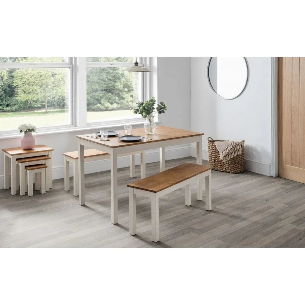 Wood dining table with benches and nested tables in bright modern dining room