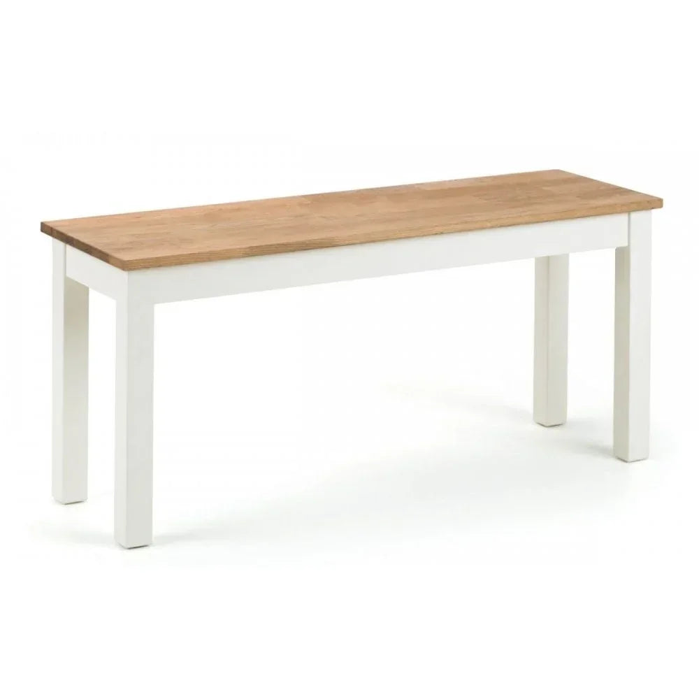 Rectangular wooden dining bench with light oak top and white painted legs on white background