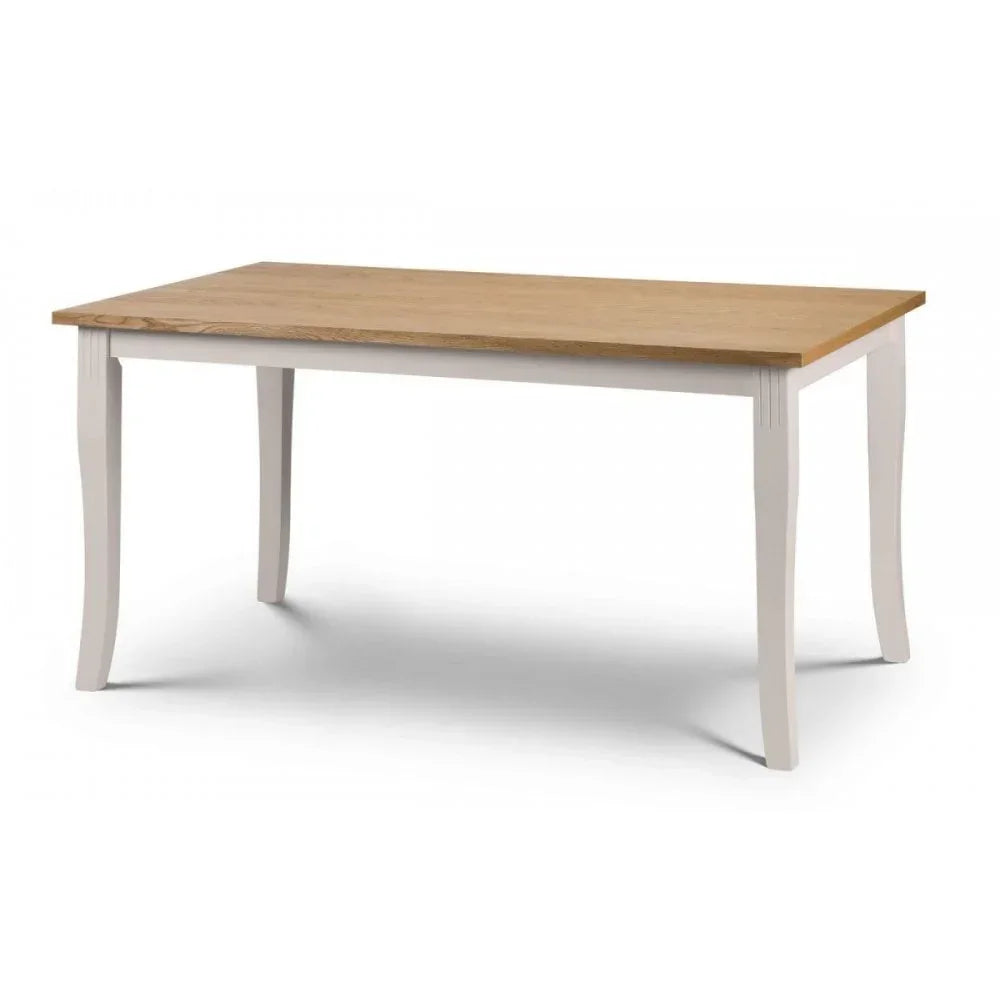 Rectangular dining table with oak top and white painted legs on plain background