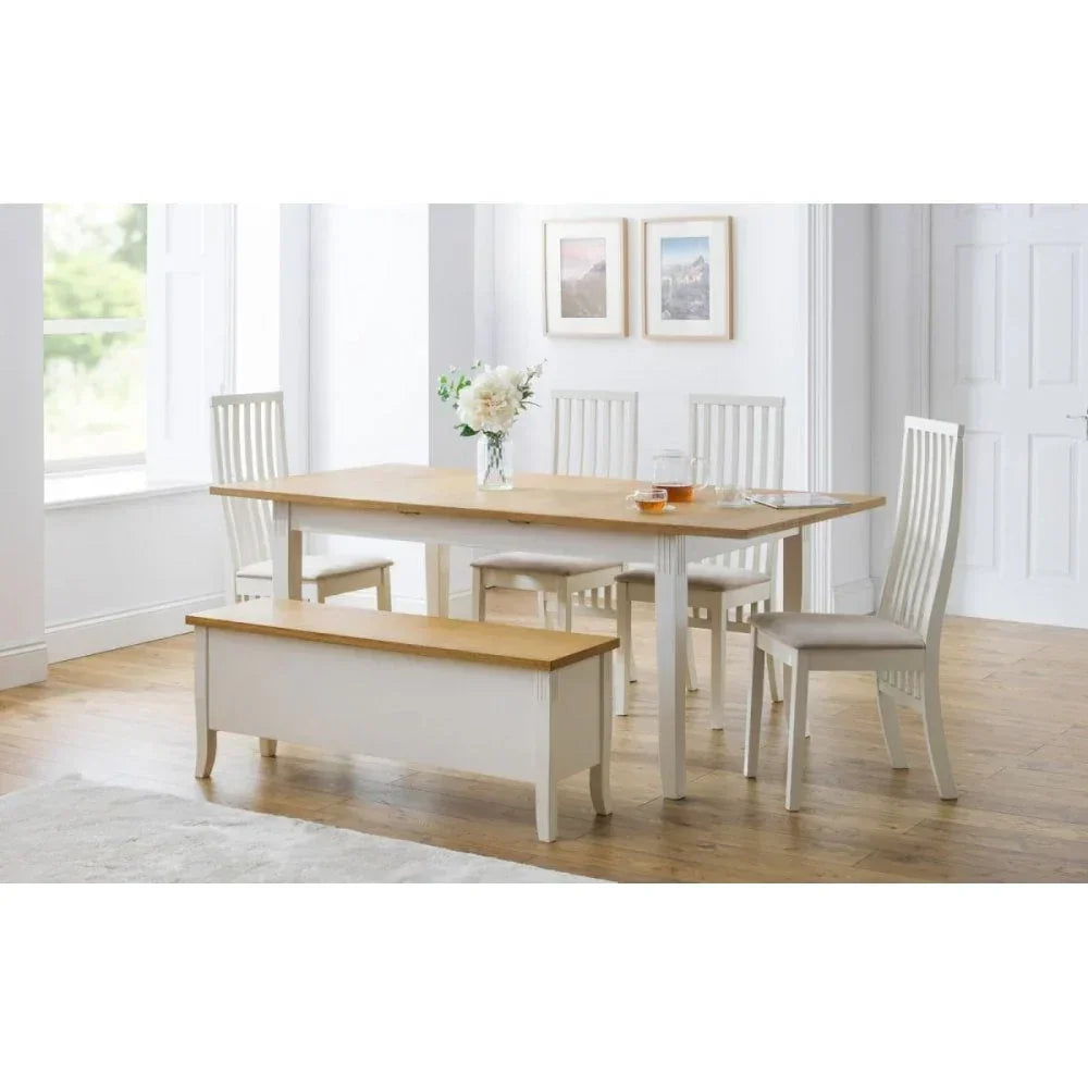 Wood dining table set with four chairs and a bench in a bright modern dining room