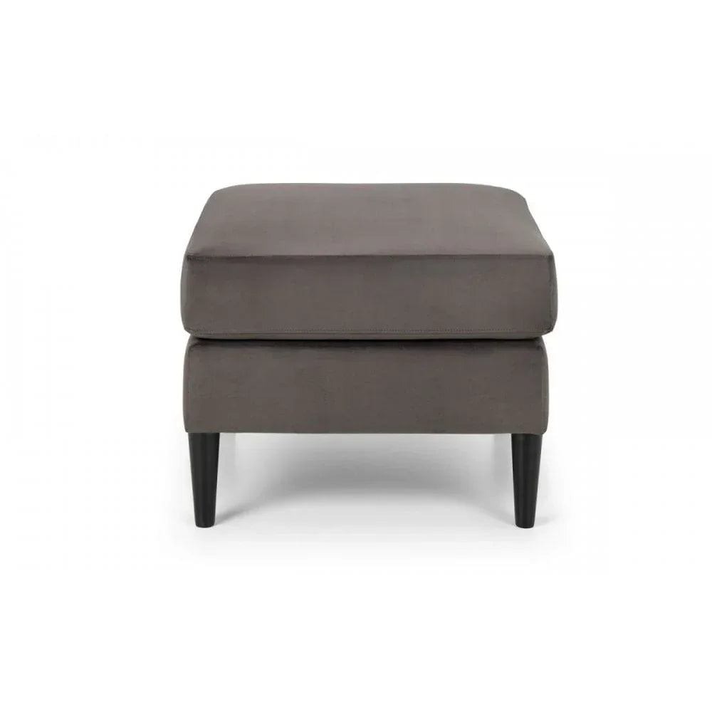 Grey upholstered ottoman with black tapered legs, front view on white background