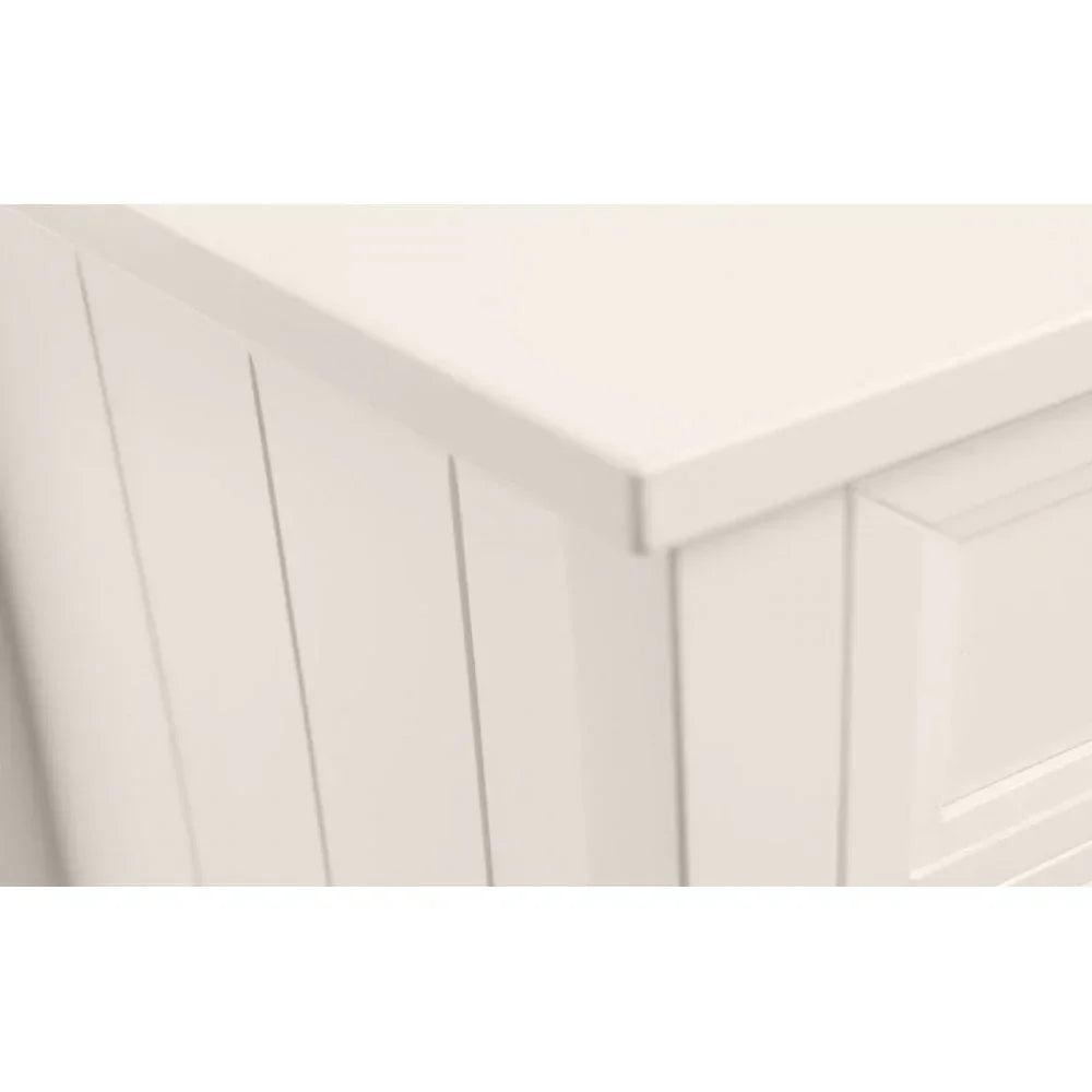 White wooden cabinet closeup showing panel detail and smooth tabletop corner