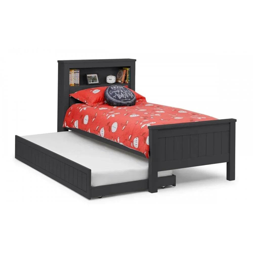 Grey wooden single bed with trundle, bookshelf headboard, and red bedding