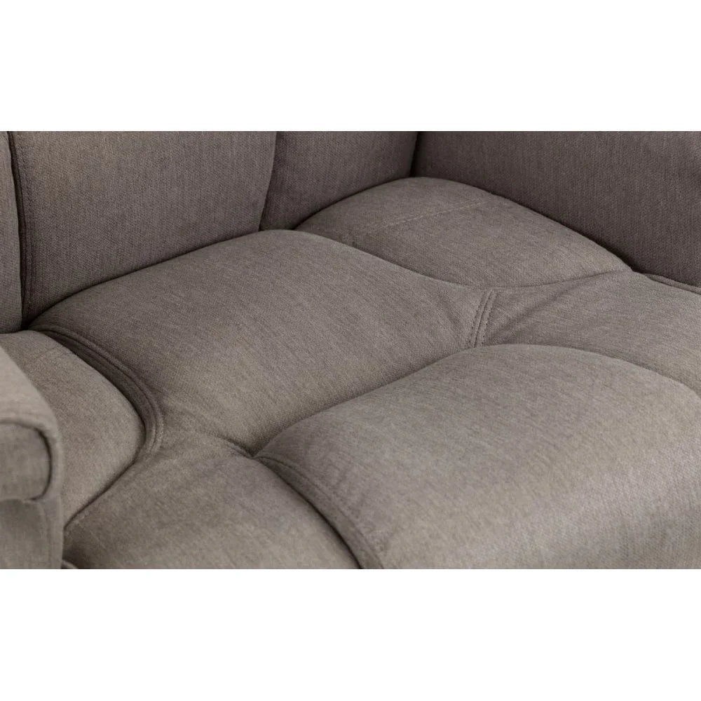 Close-up of grey fabric sofa seat with tufted cushion detailing
