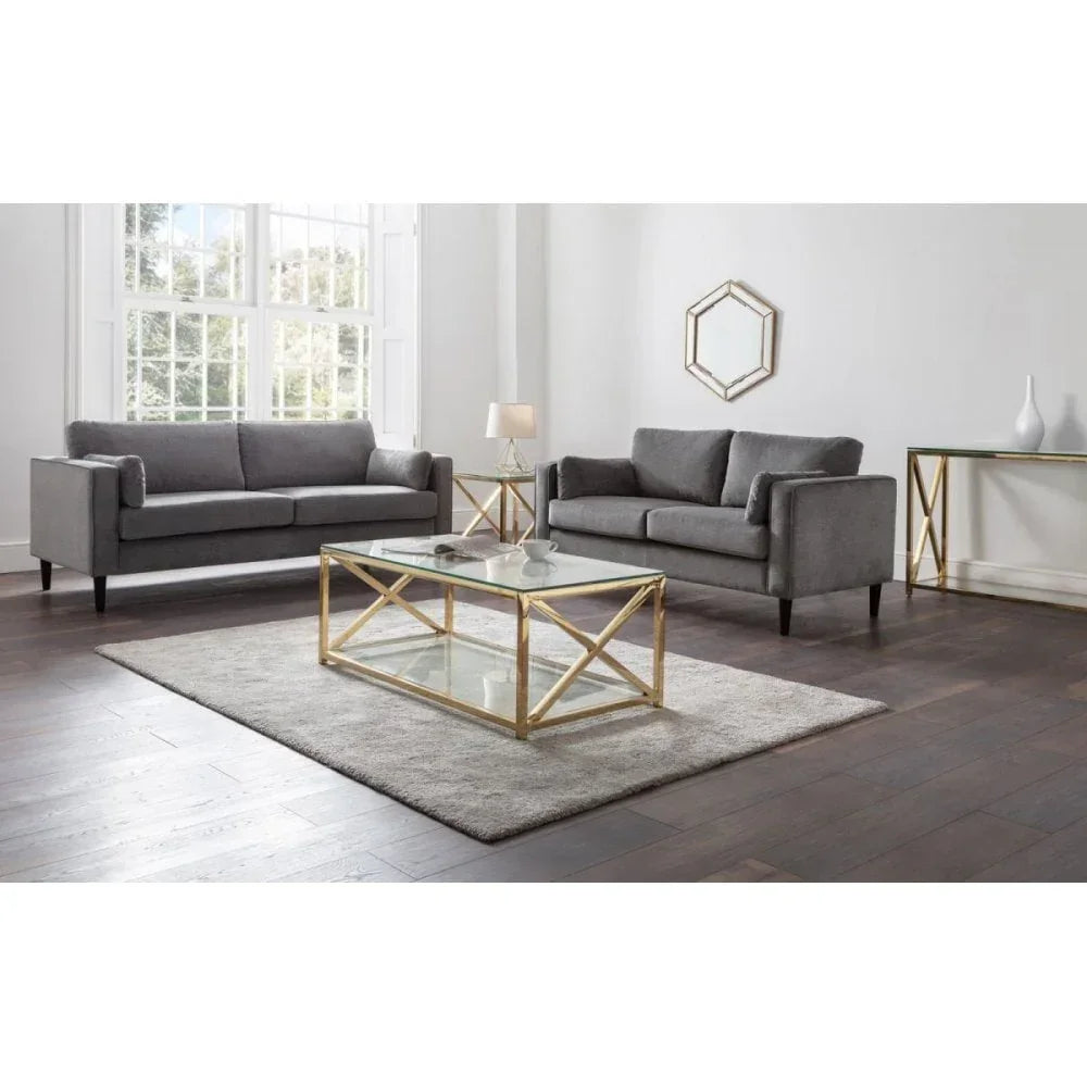 Grey fabric sofas with gold and glass coffee table in modern living room
