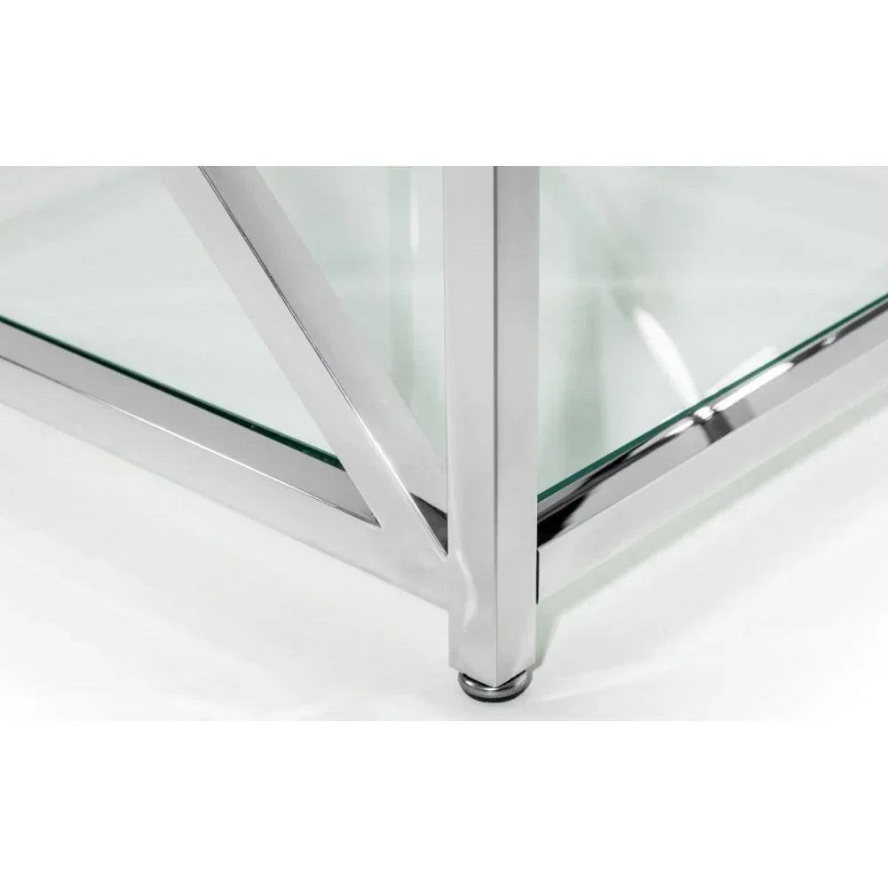 Glass coffee table corner with chrome frame and crossed metal leg detail