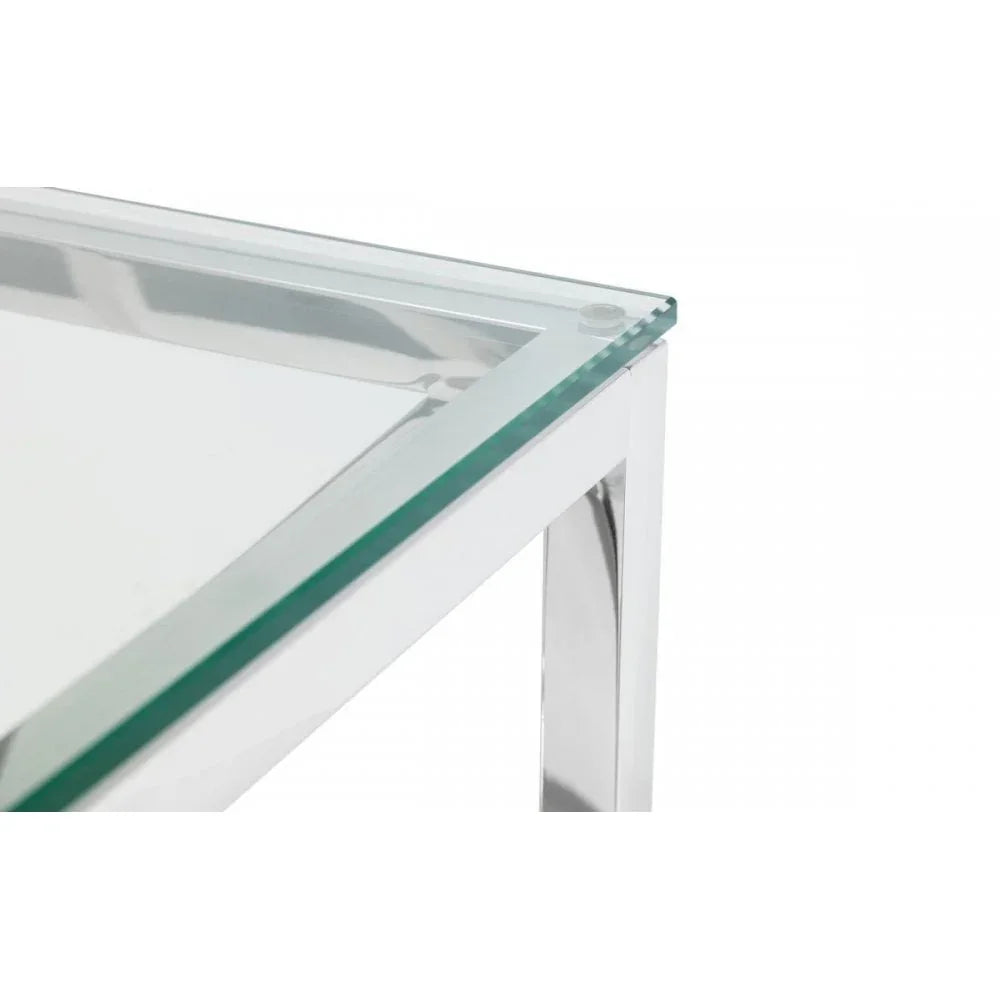 Glass top table with chrome metal frame, close view of corner and clear edges