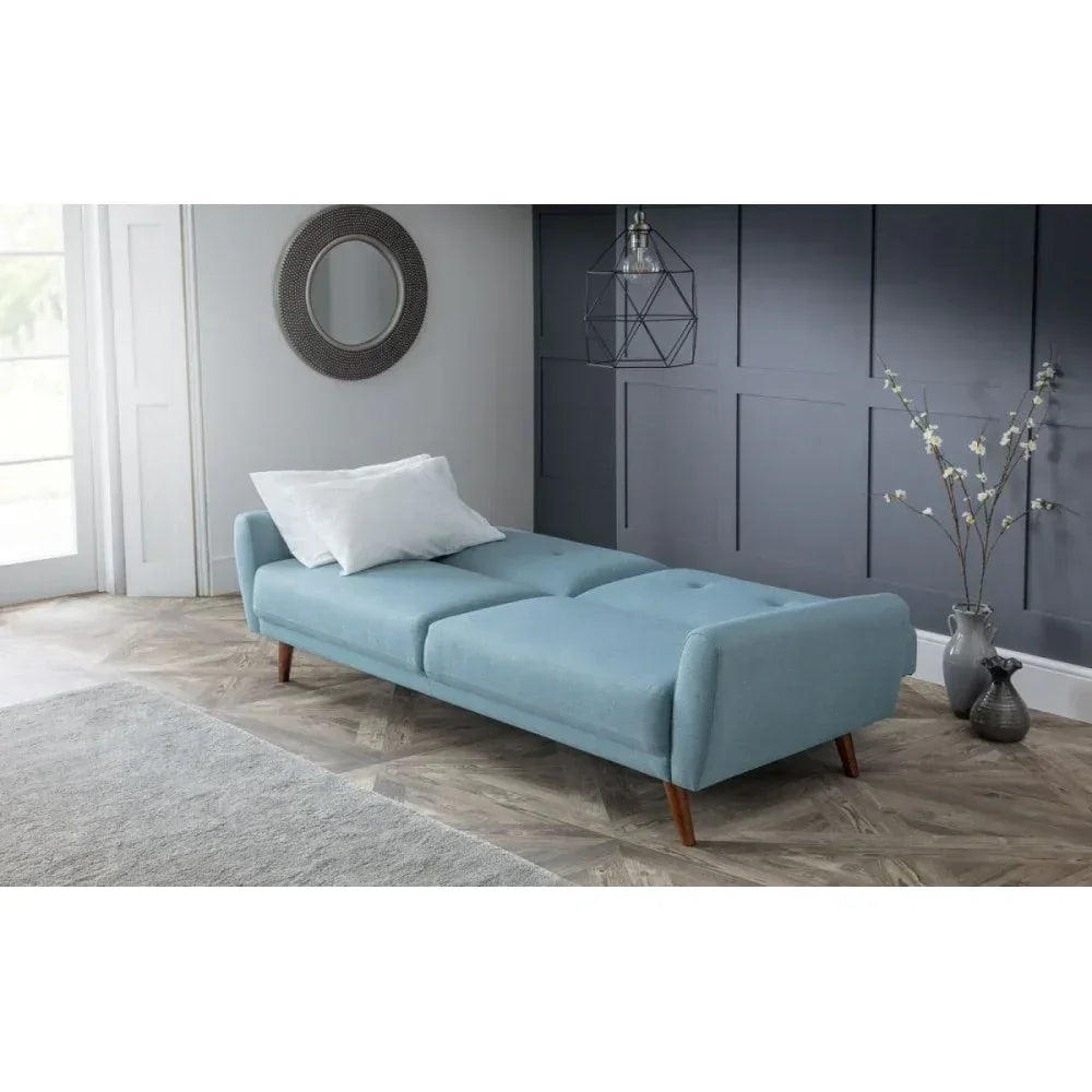 Light blue fabric sofa bed with wooden legs in modern living room