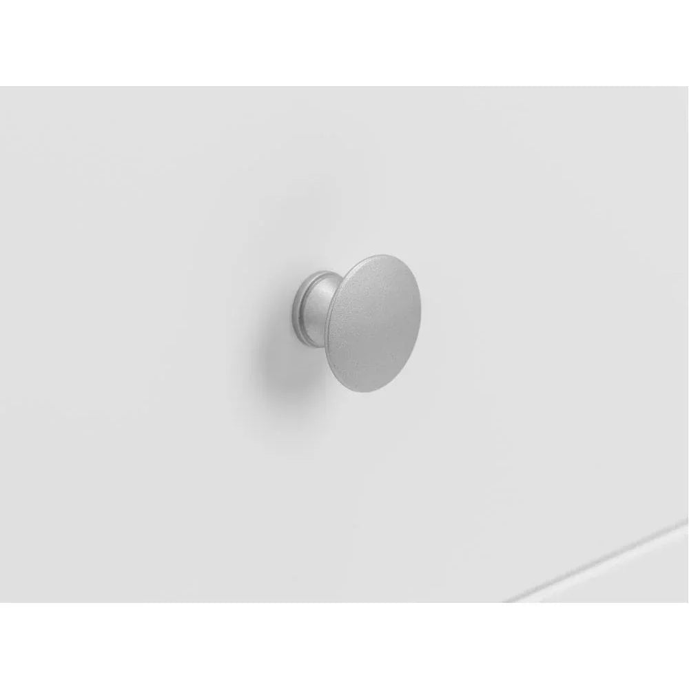 Silver drawer handle on white cabinet front, close-up view highlighting hardware detail