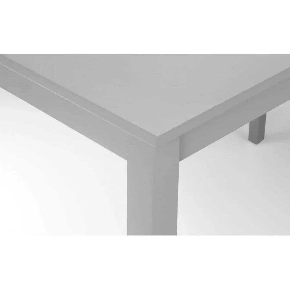 Grey dining table corner with straight legs and smooth painted finish